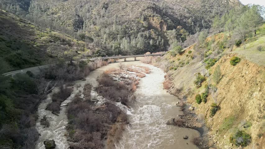 Looking down from the sky, Cache Creek’s twisting flow and rocky banks create a striking natural pattern.