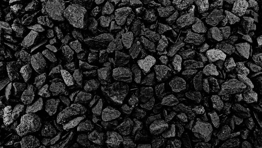 pebble gravel small stone grunge Abstract grainy texture background 4K random slide video. backdrop loop animation with some dried grass. Vintage Black n White Grayscale overlay effect