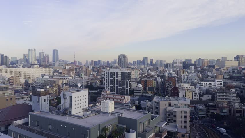 Cityscape of Tokyo with Iconic Tower
A panoramic view of Tokyo’s urban skyline with the Tokyo Tower as its centerpiece.