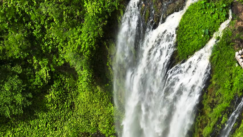 Lasang Falls with rapid stream and greenery plants. Bukidnon, Philippines.