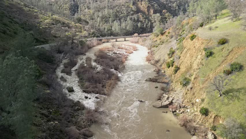 The sweeping drone view showcases Cache Creek’s peaceful yet dynamic movement through the countryside.