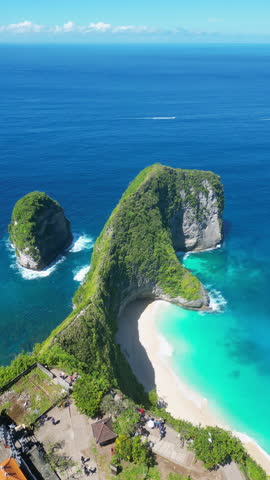 Nusa penida Bali ocean waves sandy shoreline aerial top view. Expanse ocean majestic waves sandy beach view from drone. A magical place for retreats vertical reel