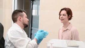 Male doctor examines neoplasms or moles on the woman patient's skin - using special apparatus for dermatoscopy digital dermoscope. Prevention of melanoma and skin cancer. World Cancer Day	 - Powered by Shutterstock - Get 15% off with code: PIKWIZARD15