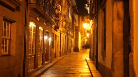 Historic Streets of Guimarães at Night on a Rainy Day with Roman Architecture and Warm Lighting - Powered by Shutterstock - Get 15% off with code: PIKWIZARD15