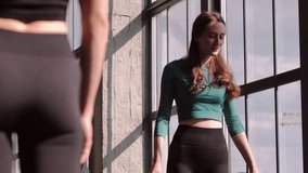 Pilates session. Gymnastic class. Fitness group unroll sport mat before workout training with female instructor barefoot in gym studio indoors. - Powered by Shutterstock - Get 15% off with code: PIKWIZARD15