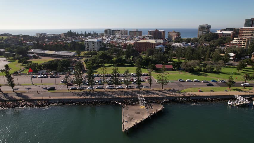 Newcastle Harbour With Foreshore Park And CBD On Banks Of Hunter River In NSW, Australia. aerial sideways shot