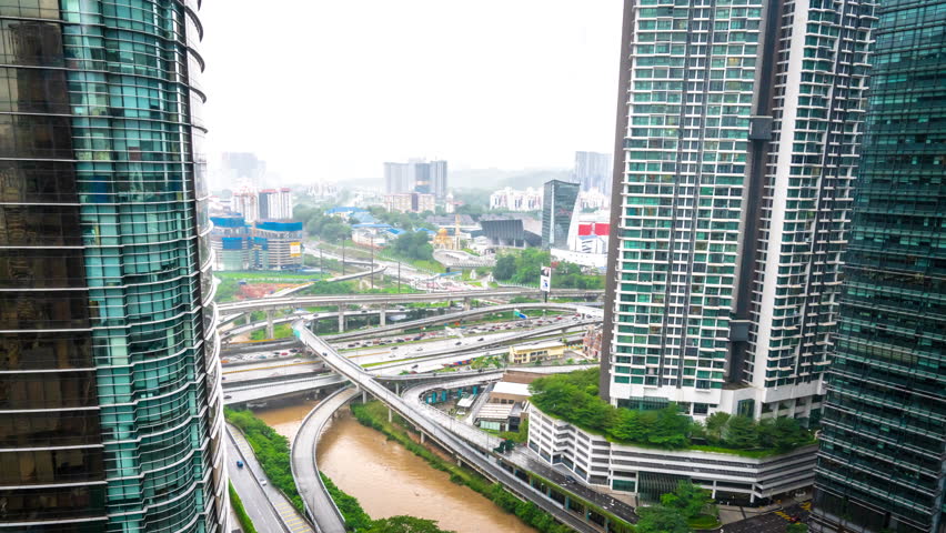 Rainy day time lapse of a traffic junction in KL