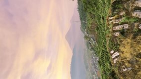 Breathtaking hill scenery with mountain view and dramatic sunrise sky. Vertical video. - Powered by Shutterstock - Get 15% off with code: PIKWIZARD15