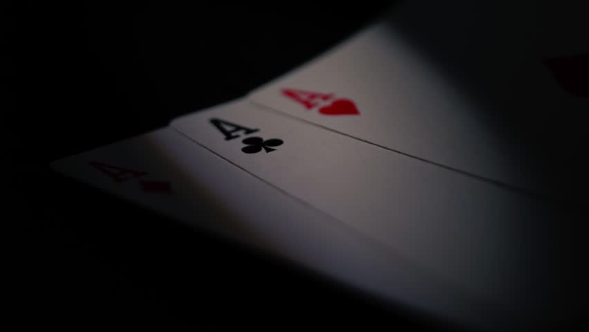Poker player holding aces playing cards close up 4k shot selective focus