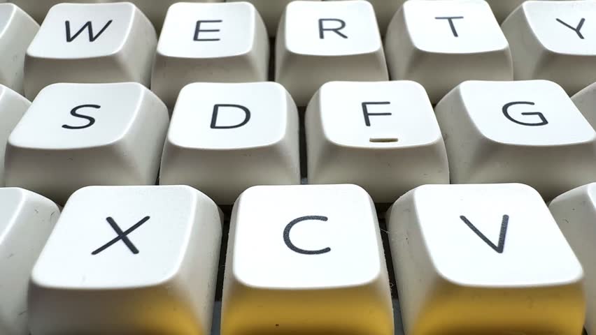 Keyboard letters on white mechanical keyboard in office
