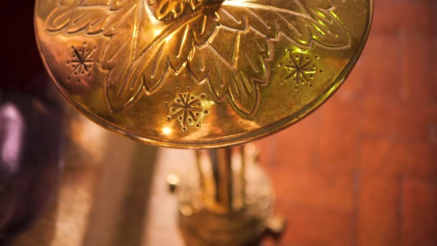 Ornate Christian Cross on Baptismal Font – Sacred Church Detail