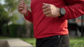 Cropped shot of body old man with wearing smartwatch during  running in the city village park, concept of wellness lifestyle for 60s retirement people and fitness healthy.
 - Powered by Shutterstock - Get 15% off with code: PIKWIZARD15