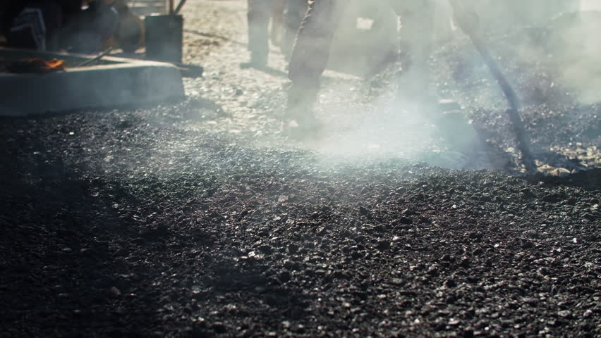 Hot Asphalt Paving on Road Construction Site