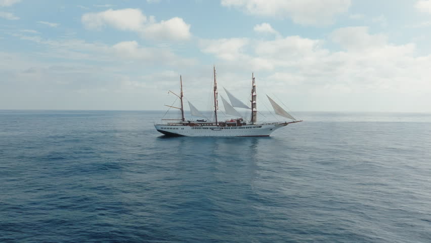 Sea cloud luxury cruise ship sailing vessel in the Atlantic Ocean under clear blue sky, Aerial