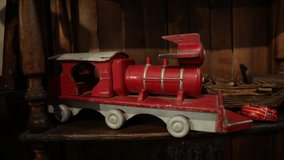 Collectible and vintage toys. Closeup view of a red wooden miniature model engine train - Powered by Shutterstock - Get 15% off with code: PIKWIZARD15