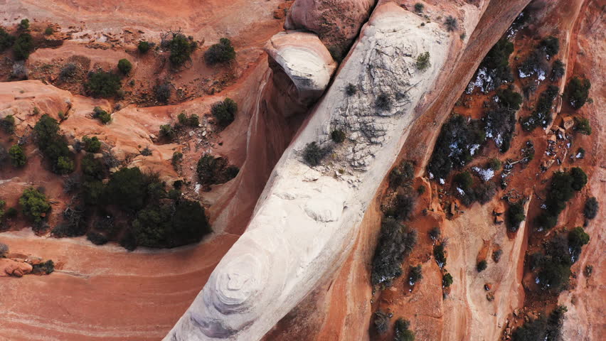 Aerial tops down hole arch Wilson formation on Earth geological surface, Arches National Park in Moab Utah, American landscape