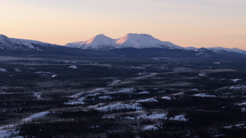 Landscape Of Icy Winter Day Near Lake Laberge In Yukon Territory Canada. Aerial Wide Shot