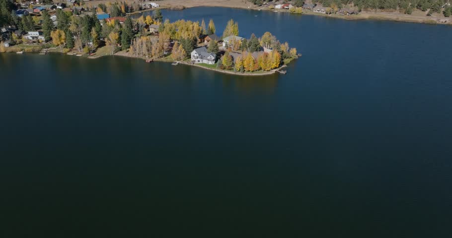 Serene aerial view of Pagosa Springs, Colorado, with colorful autumn trees by the lake