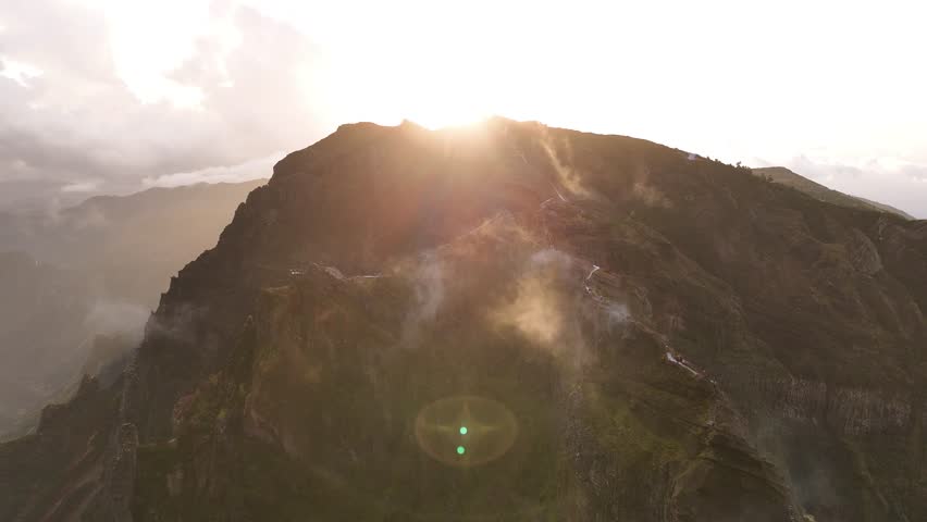 Cinematic Aerial Sunrise over Pico do Arieiro, Encircled by Majestic Peaks and Clouds, Madeira Island
