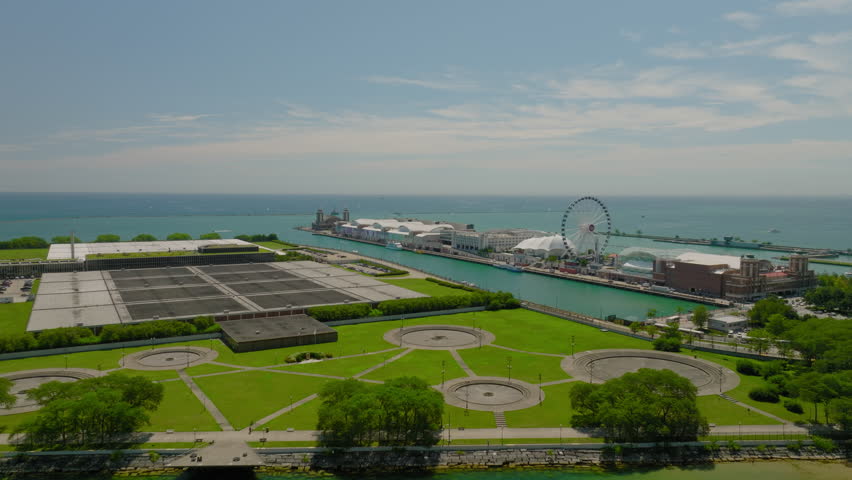 Aerial Panning Tranquil View Of Milton Lee Olive Park By Lake Michigan On Sunny Day - Chicago, Illinois