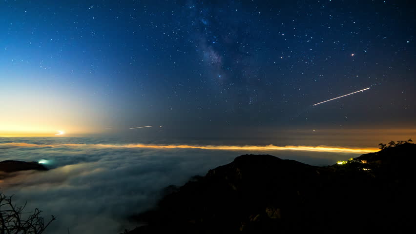 Aerial Panning Time Lapse Shot Of Airplanes Flying In Starry Sky Over Tranquil Mountains At Night - Portland, Oregon