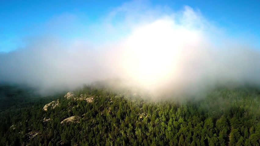 Aerial Panning Scenic View Of Clouds Over Green Mountains On Sunny Day - CO, Colorado Springs, United States of America