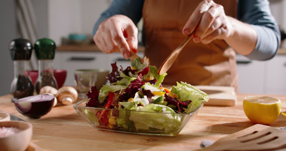 Close Up Of Mediterranean Salad Being Prepared, Fresh Ingredients, Vibrant Vegetables, Greens, Organic Herbs, Nutritious Meal, Healthy Eating Habits, Plant-Based Ingredients, Wellness Lifestyle Food