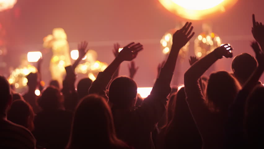 Lot people wave hands music concert. Many fans cheering fun party lift arms up. Crowd hang out cool night life fest, k pop chill. Epic neon light. Joy dj enjoy kpop. Live arena. Funky musical beat