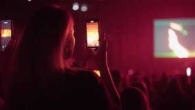 Lot fun people record music video use mobile phone. Fan crowd shoot k pop live concert. Many men hang out cool rave fest. Joy group chill night club hall. Dj star raise hand up. Take neon light photo. - Powered by Shutterstock - Get 15% off with code: PIKWIZARD15