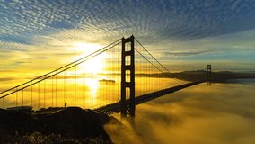 Aerial Lockdown Time Lapse Scenic View Of Golden Gate Bridge Amidst Clouds During Tranquil Sunset - San Francisco, California - Powered by Shutterstock - Get 15% off with code: PIKWIZARD15