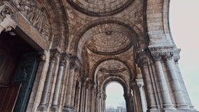 Archways exterior view of the historic Sacre-Coeur Basilica with detailed carvings and columns, Paris, France. - Powered by Shutterstock - Get 15% off with code: PIKWIZARD15