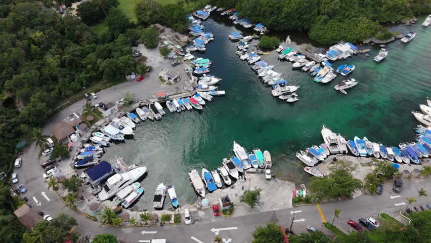 Harbor, boats, crystal clear water and aerial view