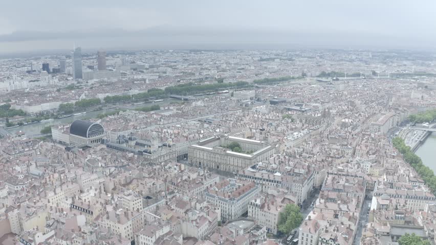 Aerial perspective of beautiful tourist attraction Lyon, featuring Hotel De Ville, Place des Terreaux to Basilica of Notre Dame of Fourvière and buildings around Seine river