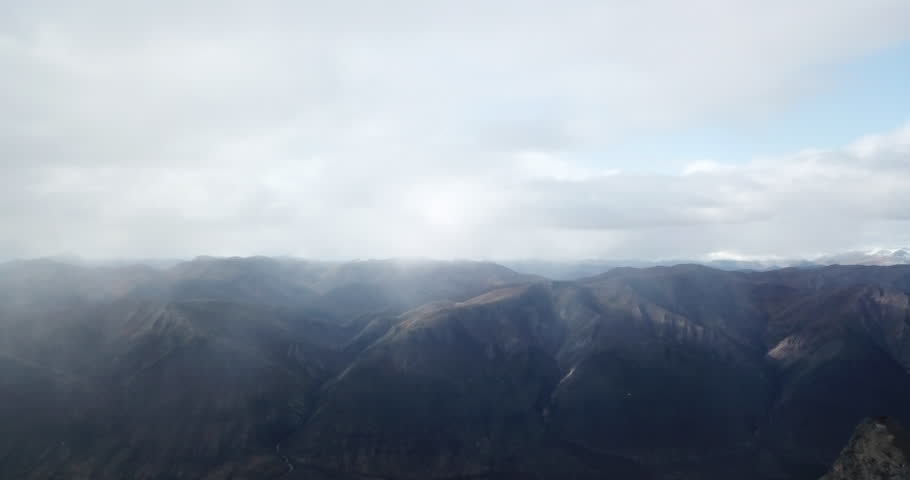 Aerial: A Vast Range Of Mist-Covered Mountains Extends Into The Horizon, Blending Soft Contours And Shadows - Sukakpak Mountain, Alaska