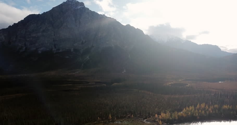 Aerial: A Towering Mountain Rises Dramatically, Illuminated By Soft Sunlight - Sukakpak Mountain, Alaska
