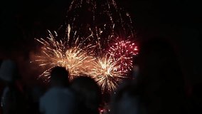 Multi-colored colorful fireworks against the background of people on a holiday. Copy space for text, outdoors - Powered by Shutterstock - Get 15% off with code: PIKWIZARD15