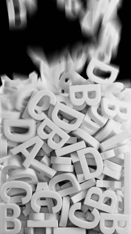 Lot of white 3D models of alphabet letters falling from top to bottom filling alpha channel screen, vertical video, 3d animation