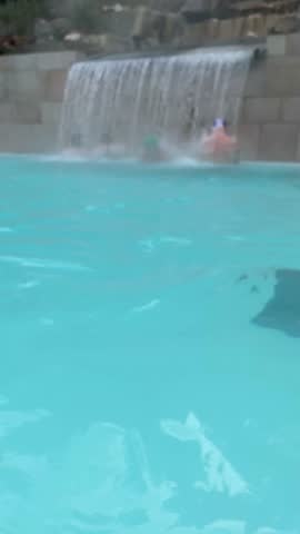 
 Person enjoying  thermal water in a pool hot springs