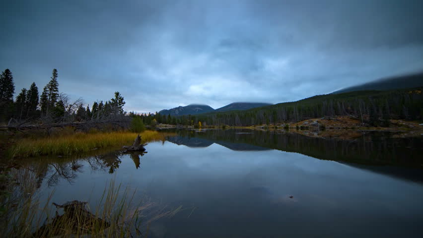 Lockdown Time Lapse Scenic View Of River By Mountains In National Park Under Cloudy Sky - Rocky Mountain National Park, Colorado
