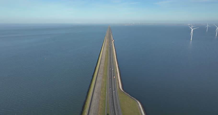 Afsluitdijk, road in endless water, between Friesland and North Holland. Dutch icon. Aerial drone view.