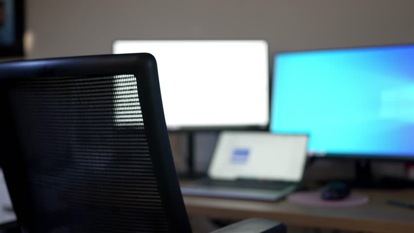 Empty Office with Aeron Chair, Laptop and Multiple Monitors