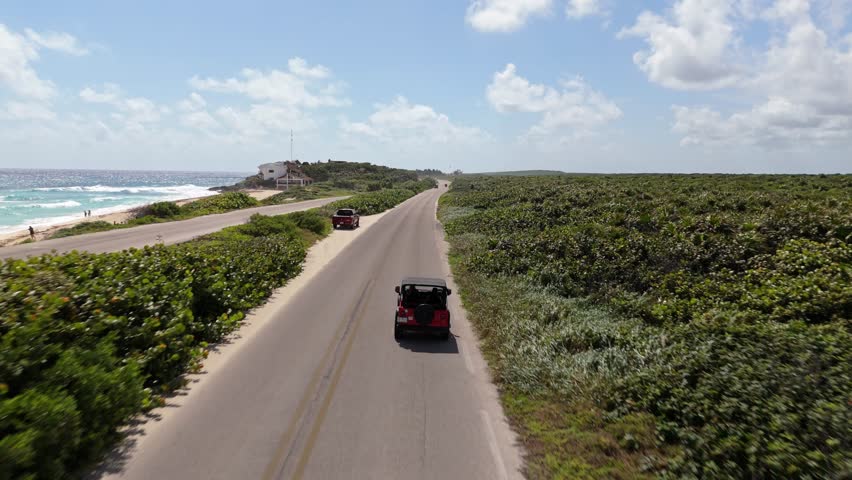 Road trip in Mexico, aerial view of the car as a third person