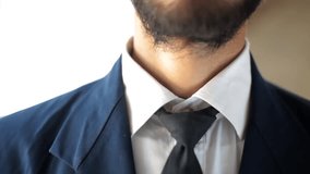 Close-Up of Tired Businessman Removing Tie End of Workday Formal Wear Corporate Office Executive Style HD - Powered by Shutterstock - Get 15% off with code: PIKWIZARD15