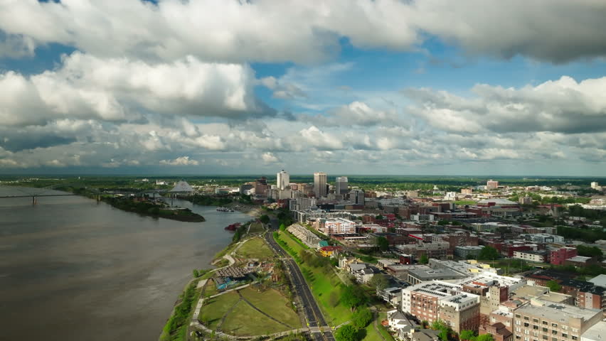 Aerial Panning Scenic View Of City By Bridge Over River On Sunny Day - Memphis, Tennessee