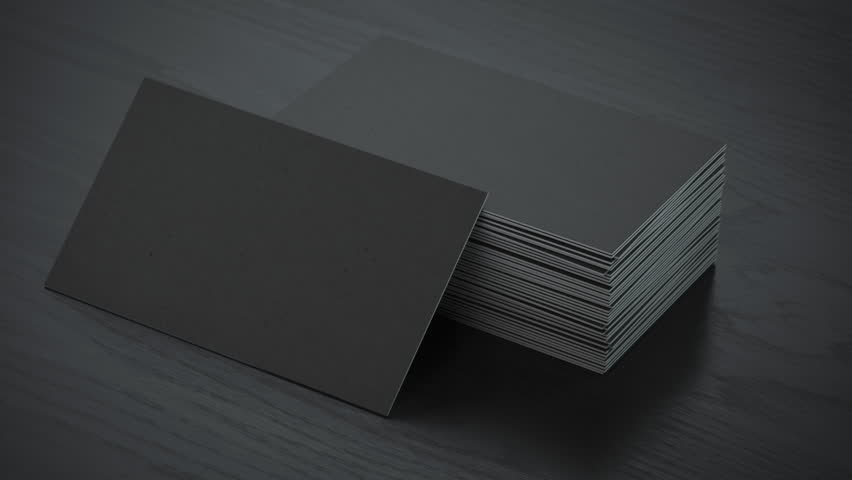Stack of black blank business cards mockup on black table 3d animation. 3D Illustration