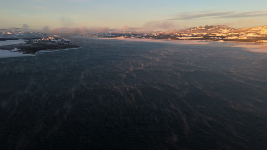 Sunset Light Over Lake Laberge, North of Whitehorse, Yukon In Canada. Aerial Wide Shot