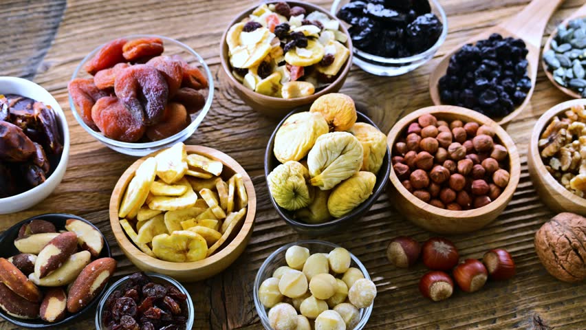 A variety of dried fruits and assorted nuts. Delicacies.