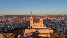 Aerial cityscape view of Marseille during sunset , Drone fly close to Notre-Dame de la Garde Catholic basilica - Powered by Shutterstock - Get 15% off with code: PIKWIZARD15