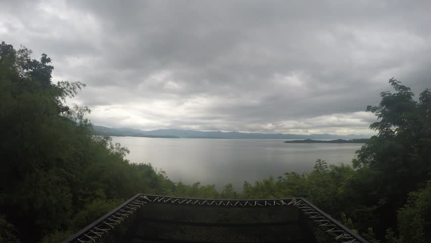 Serene Lake View with Moving Clouds Overhead 