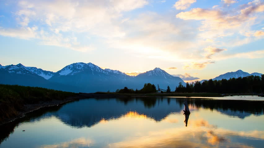 Lockdown Time Lapse Scenic View Of Tranquil Snowcapped Mountains During Sunset - Seward, Alaska
